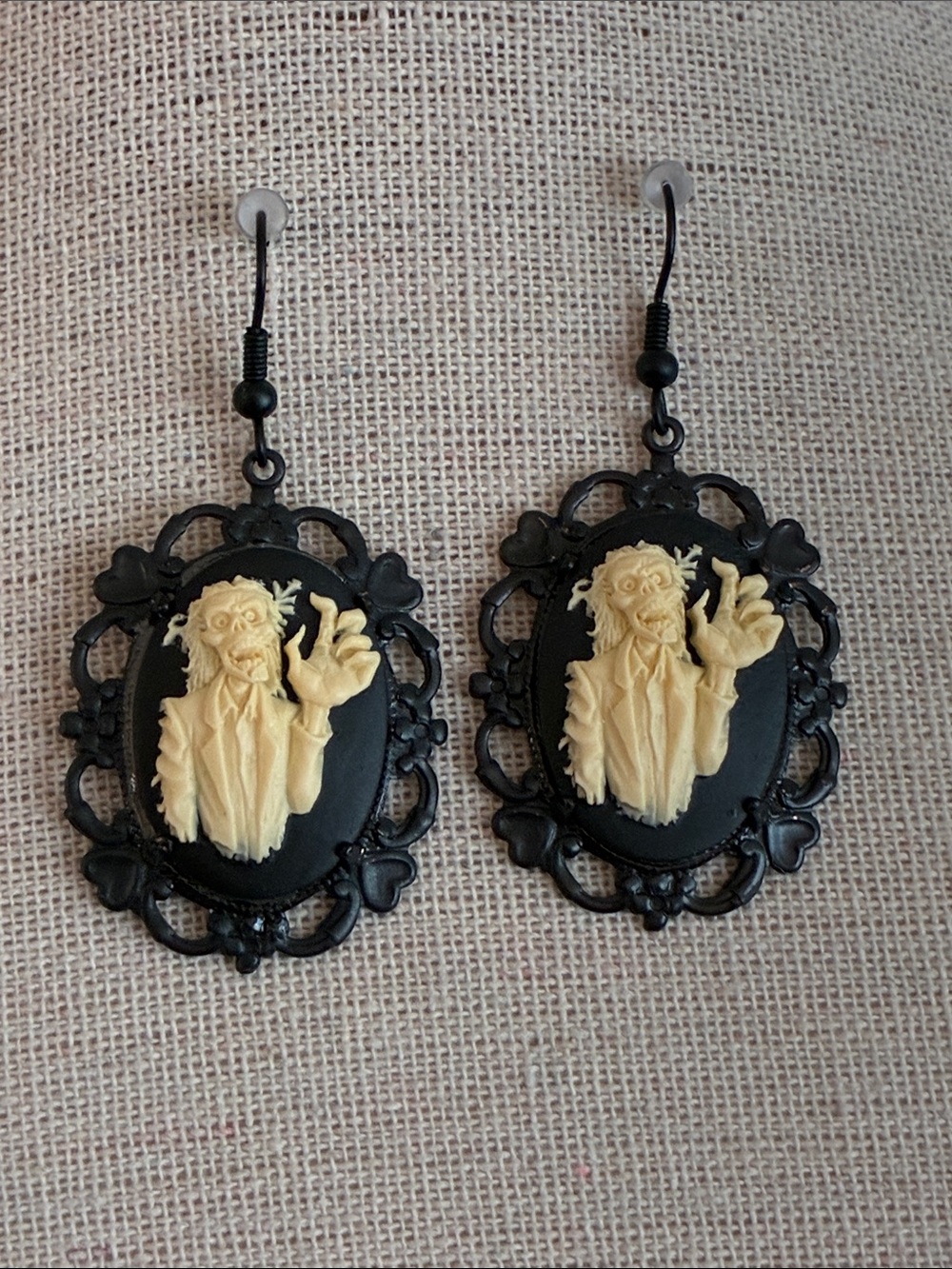 Zombie black and ivory relief cameo dangle earrings in black toned setting